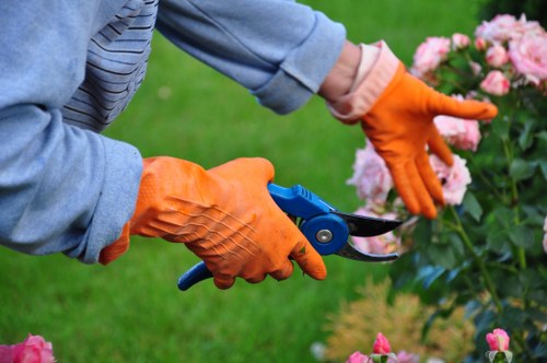Charity volunteers reusing garden furniture and planters